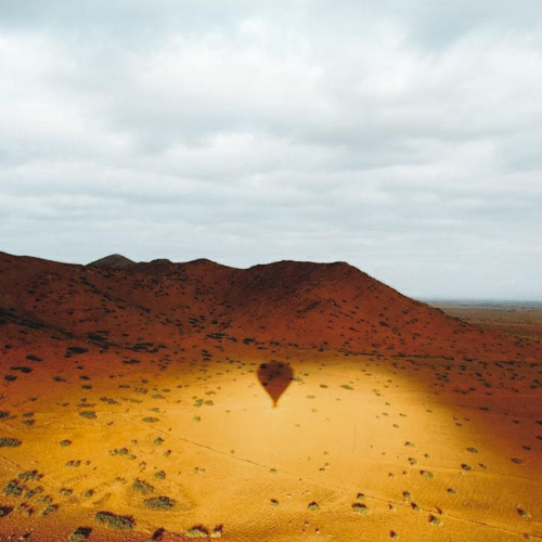 Marrakech Hot Air Balloon shadow reflecting on the desert ground