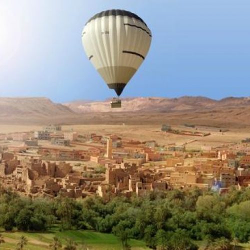 Marrakech Hot Air Balloon flight over a village with view on Atlas mountains